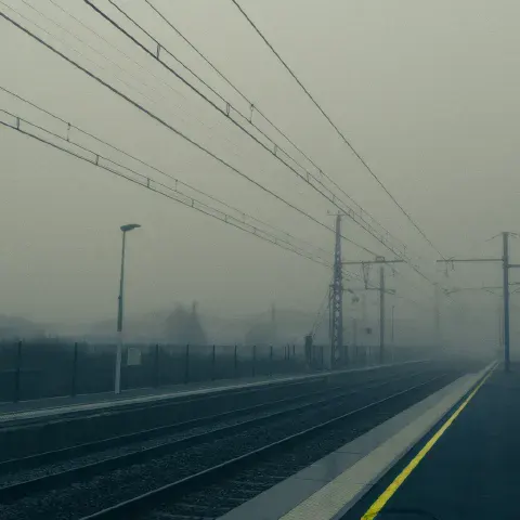 A train station in the fog